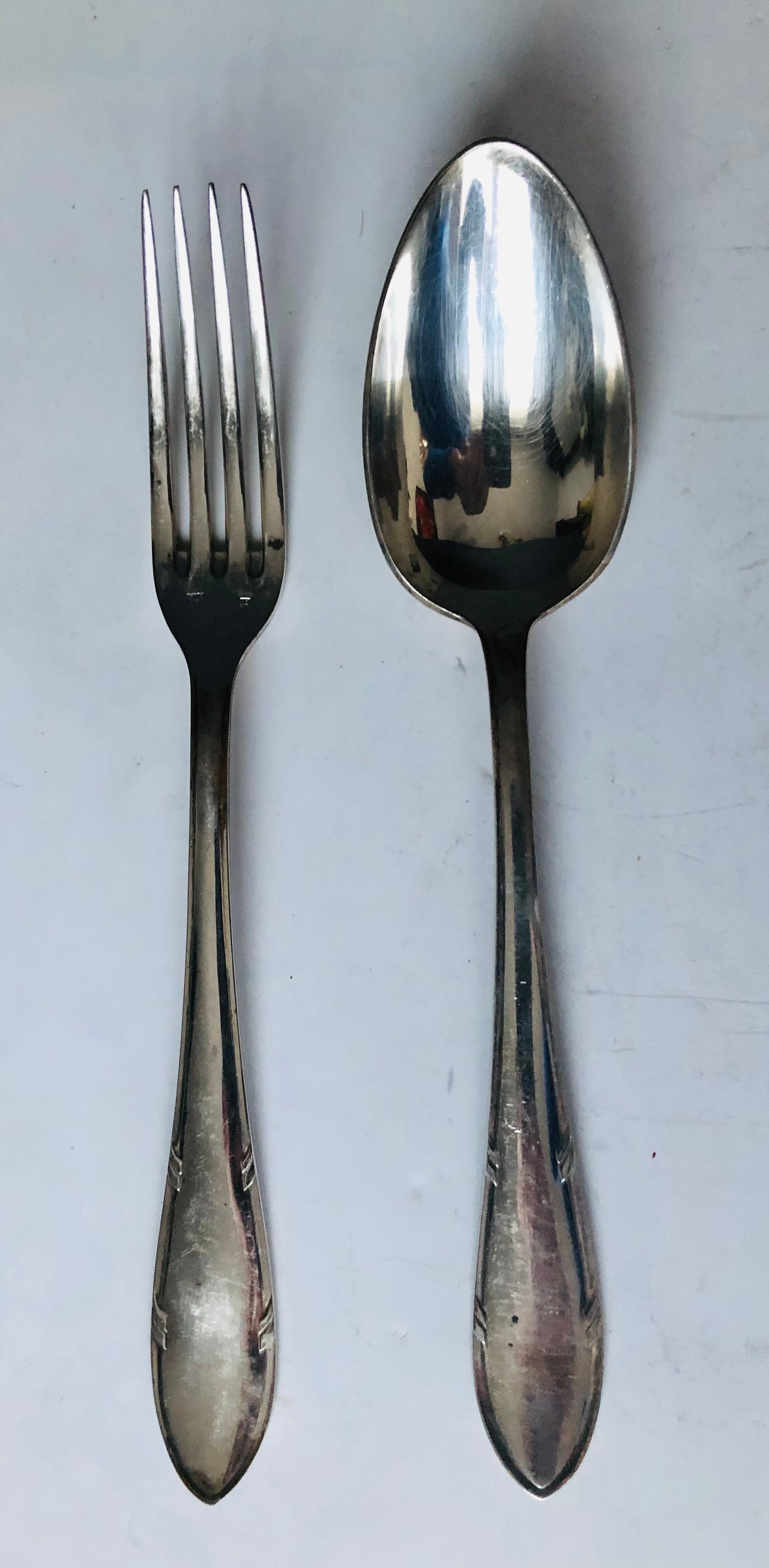 Set of twelve silver metal cutlery (24 pieces)
