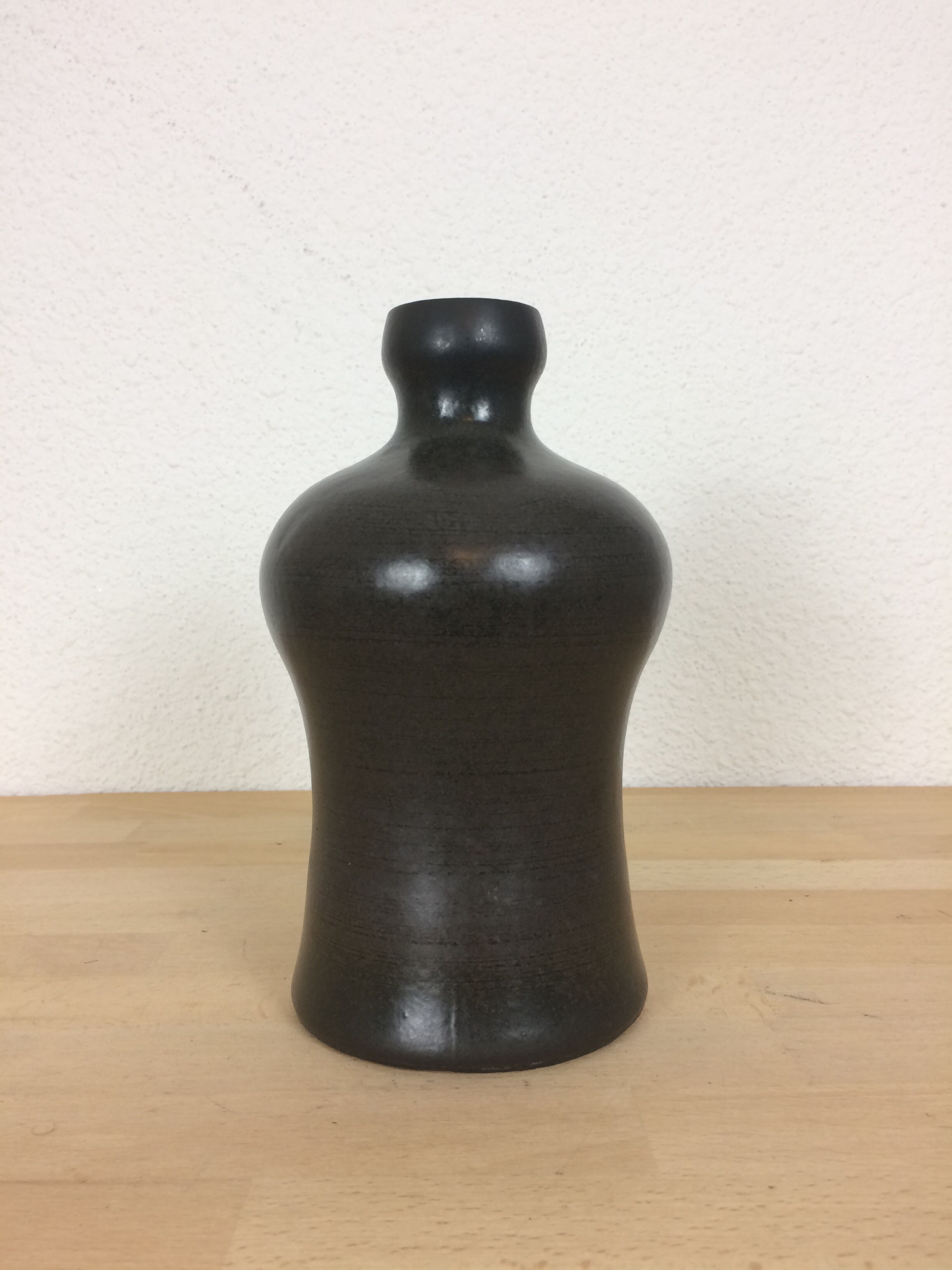 Black ceramic vase with handle