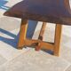 Rustic handcrafted coffee table with a mahogany top and elm legs.