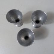 3 old aluminum shells