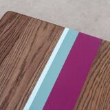 Solid oak coffee table with colored bands on pin legs