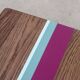 Solid oak coffee table with colored bands on pin legs