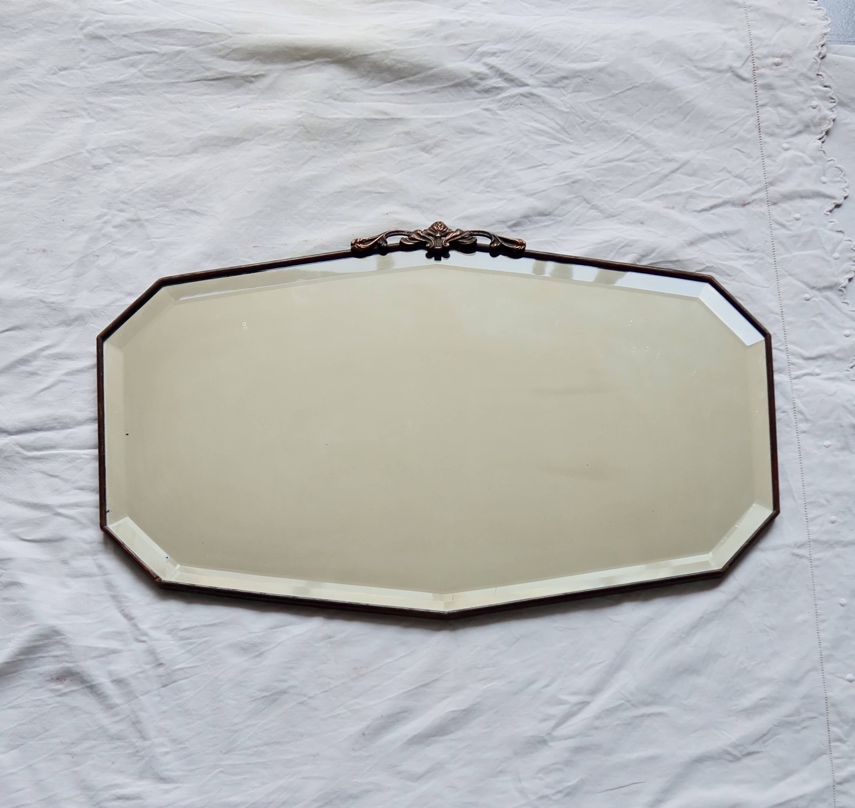 Large antique beveled mirror – dark wood and decorative bronzed metal knot