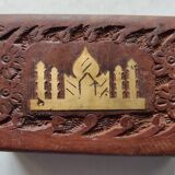 Old wooden box carved with flowers and brass