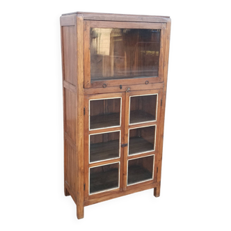 Old wooden glazed cabinet with sliding top door inside