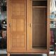 Vintage wooden wardrobe with sliding doors