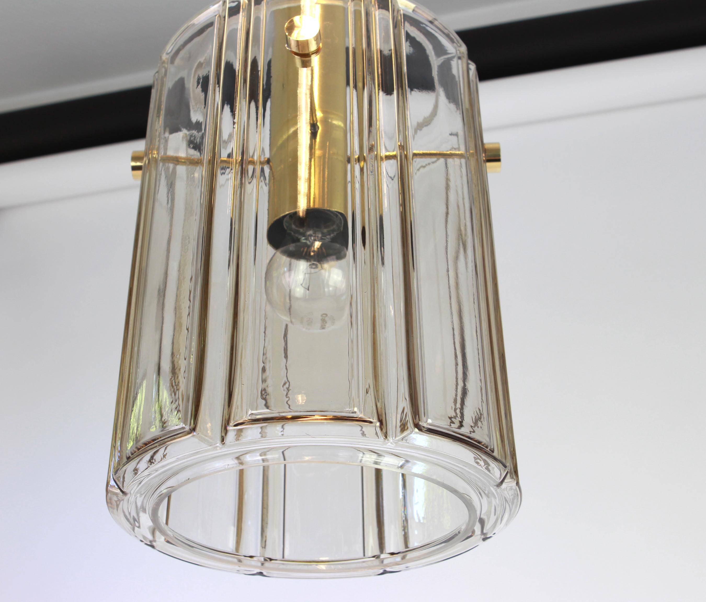 Large lantern-shaped pendant light with cylindrical glass shade by Limburg, Germany, 1960s.