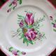 Three small hand-painted Saint-Clément dinner plates.