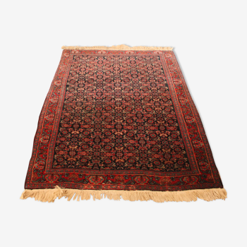 Wool rugs with stylized plant decorations on a red and blue background