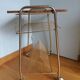 Table trolley for vinyls or magazines in gold metal and formica