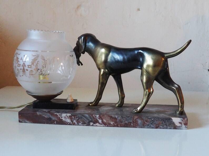 French Art Deco hunting dog on a marble base with a switched lamp.