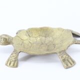 Empty brass turtle pocket