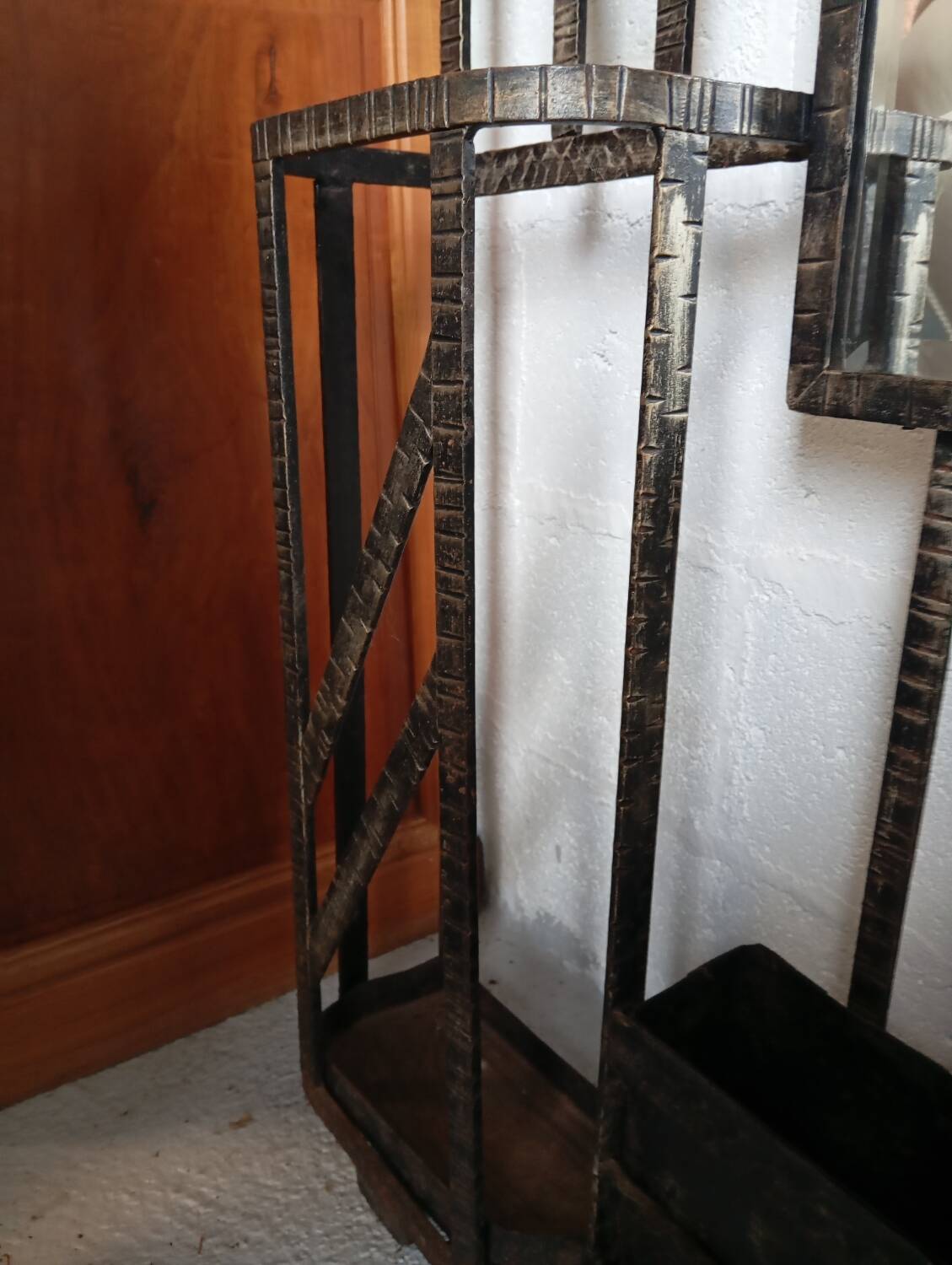 Exceptional and imposing hall wardrobe in hammered wrought iron.