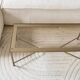 Coffee table in gold metal and glass