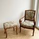 Old armchair with its stool