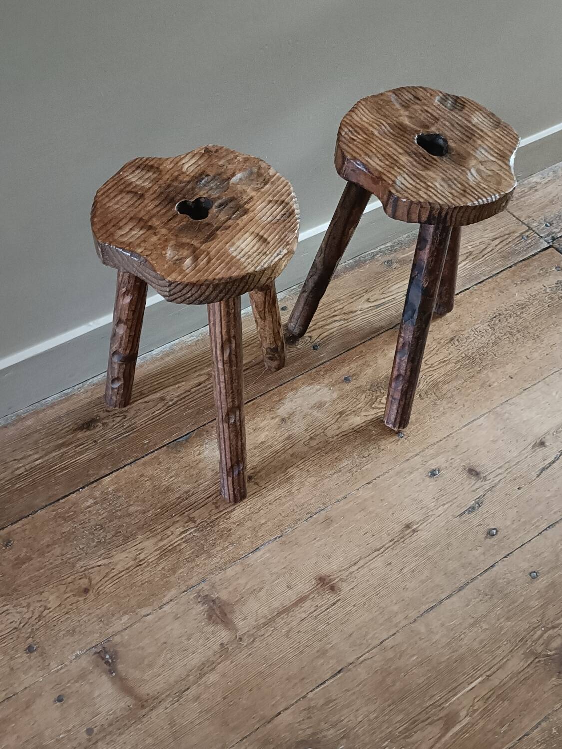 A pair of tripod stools