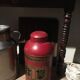 Asian red metal pot with lid