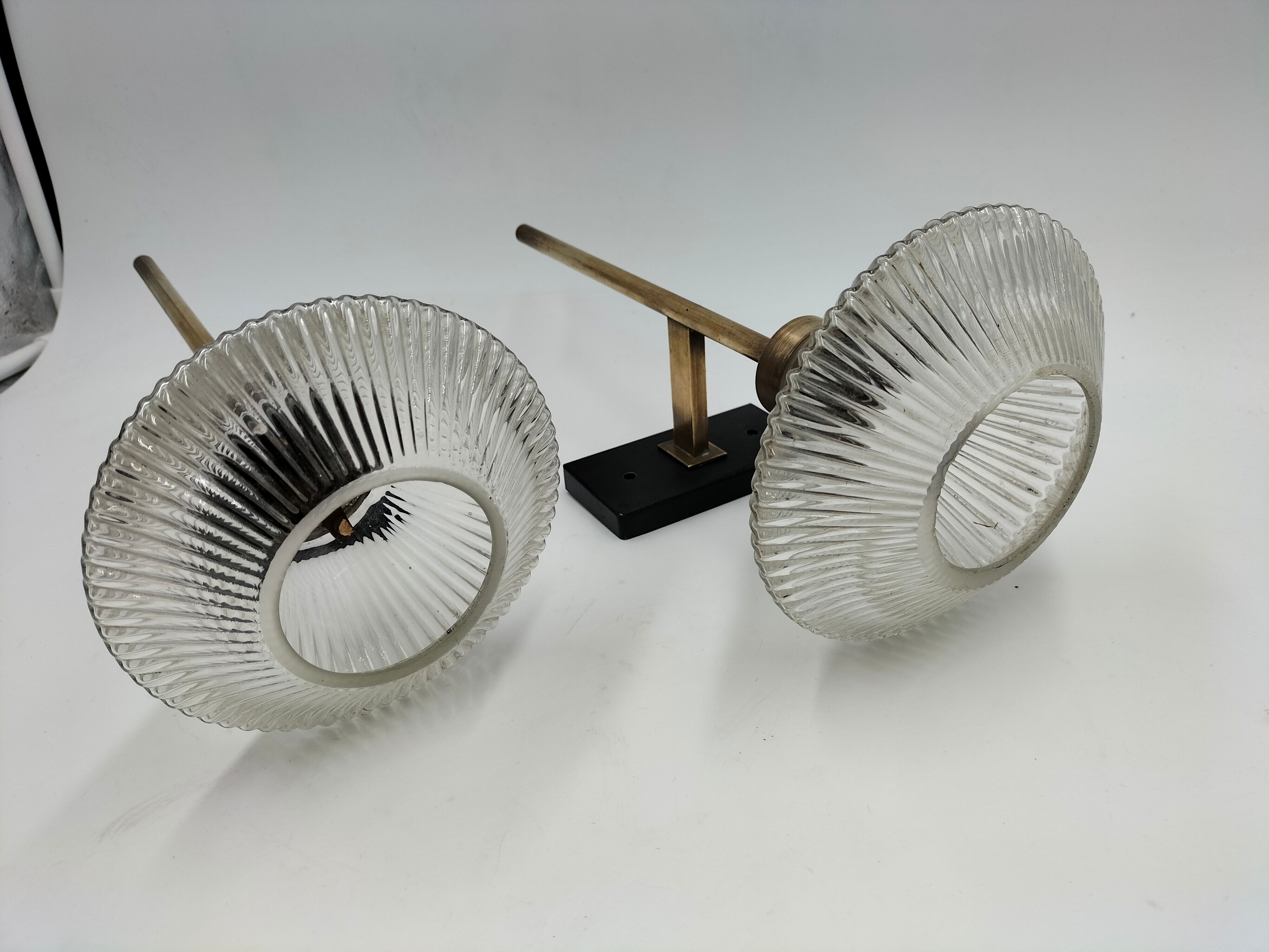 Pair of brass and glass wall lamps
