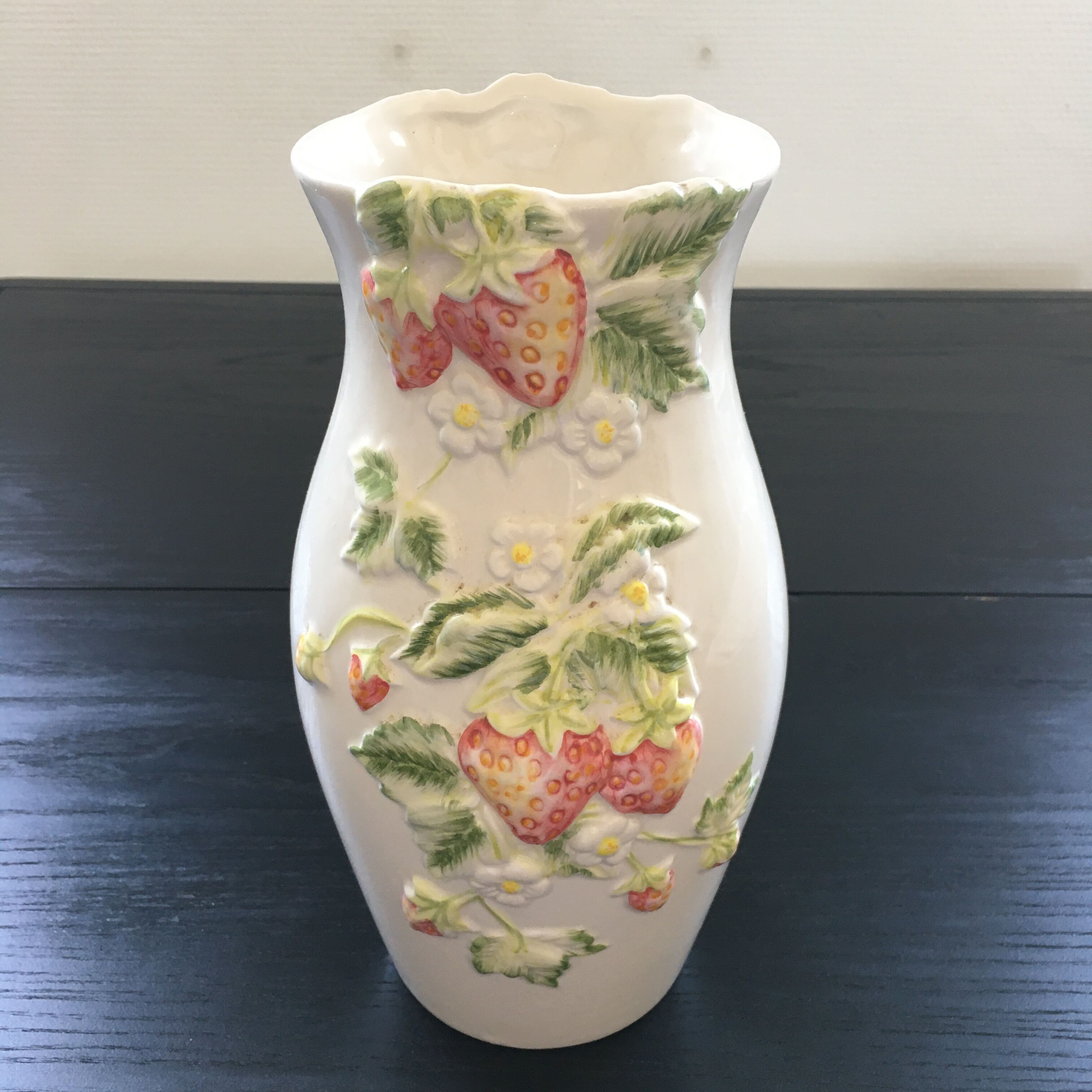 Vase decorated with strawberries in slip