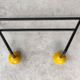Two vintage metal and wood ball coat racks