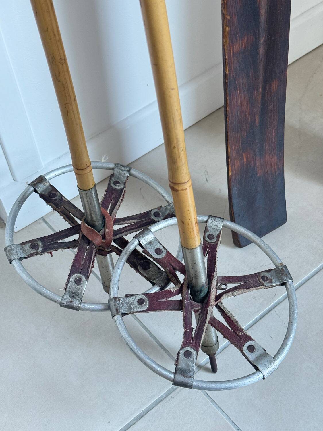 Antique wooden skis with vintage poles