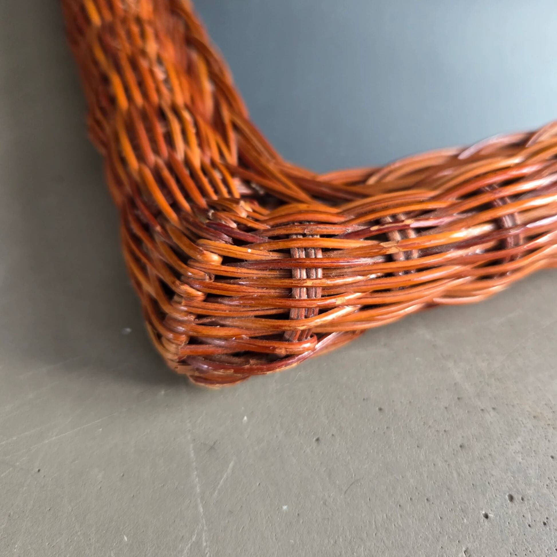 Vintage woven rattan mirror