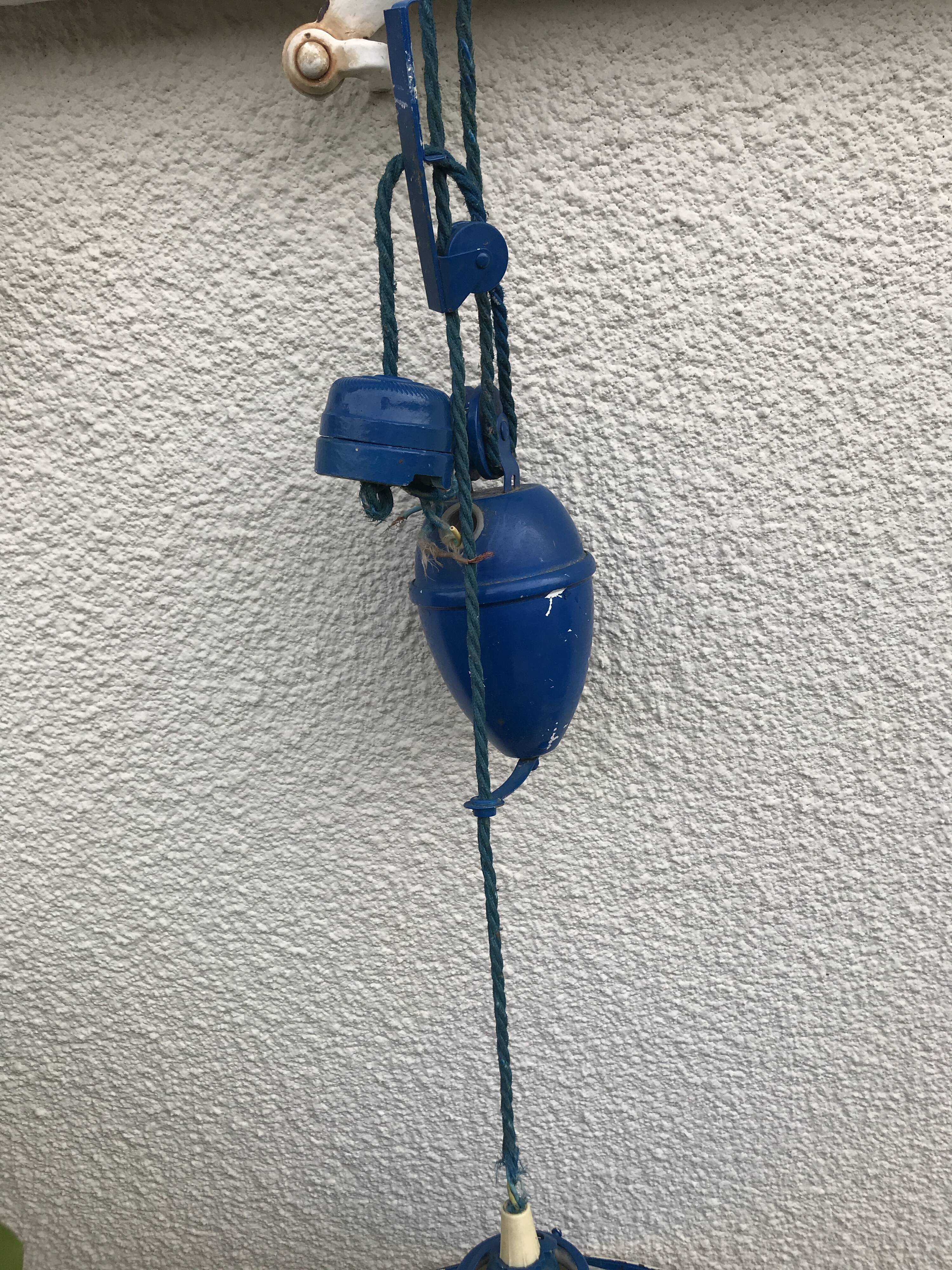 Blue and white painted metal hanging and its mount and drop