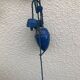 Blue and white painted metal hanging and its mount and drop