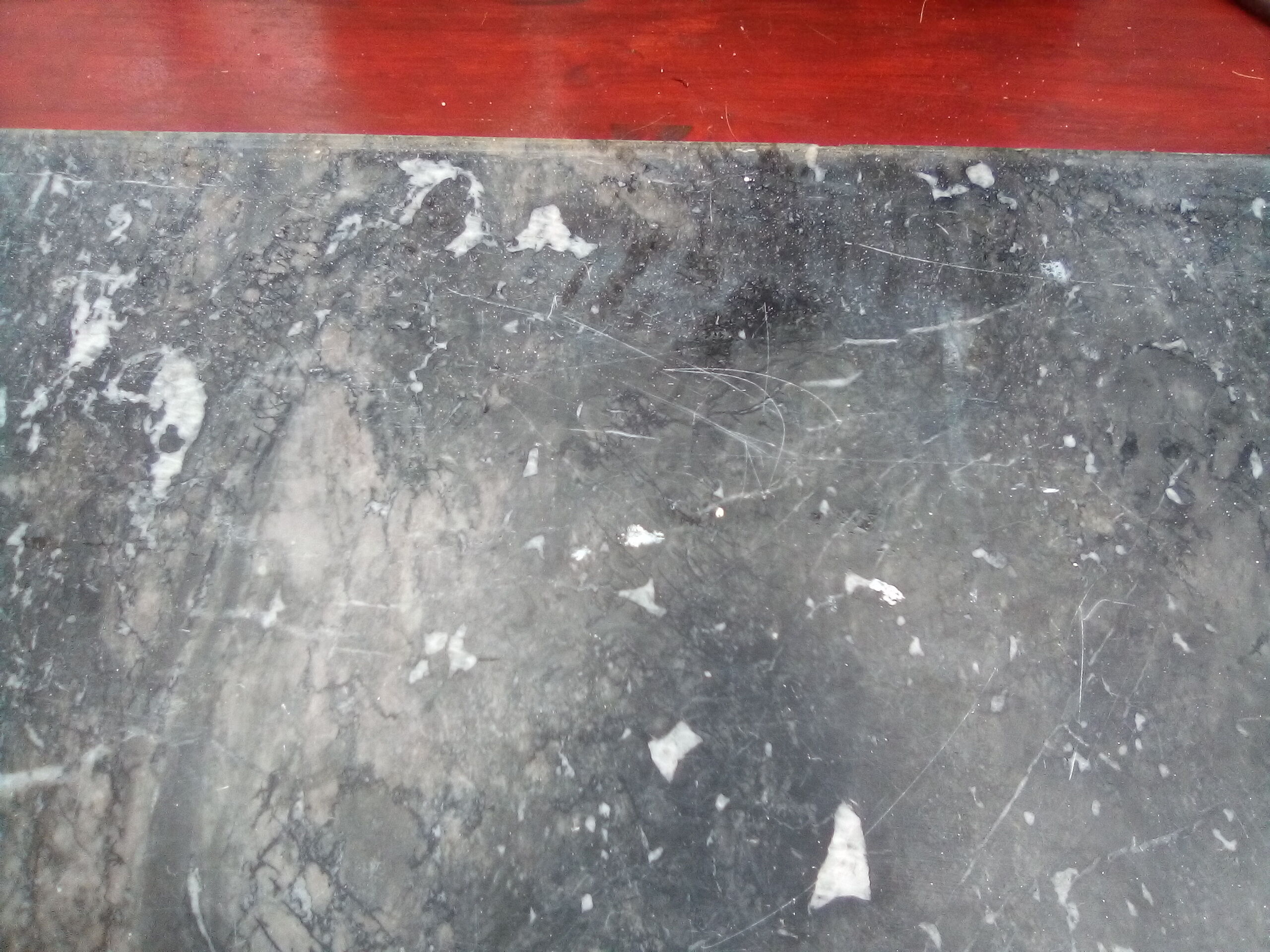 White veined black marble fireplace