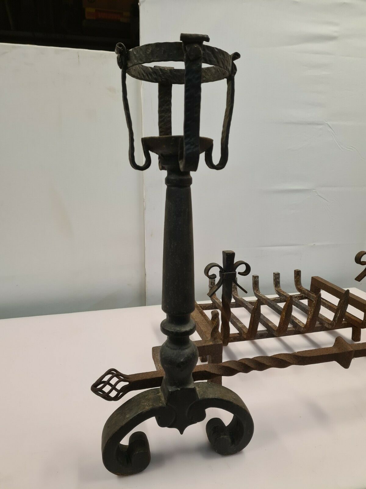 Pair of cast iron andirons for the fireplace