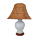 Ceramic lamp with rattan lampshade.