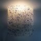 Pair of vintage wall sconces in transparent and wavy blue perspex. Year 60