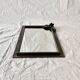 Vintage wall mirror in varnished steel decorated with a rose in relief