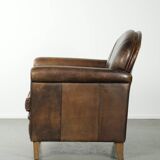 Characterful sheepskin design armchair with beautiful patina
