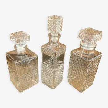 Set of 3 vintage whisky carafe bottles in molded glass