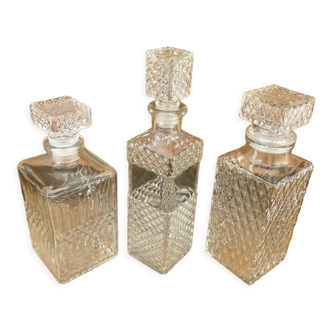 Set of 3 vintage whisky carafe bottles in molded glass