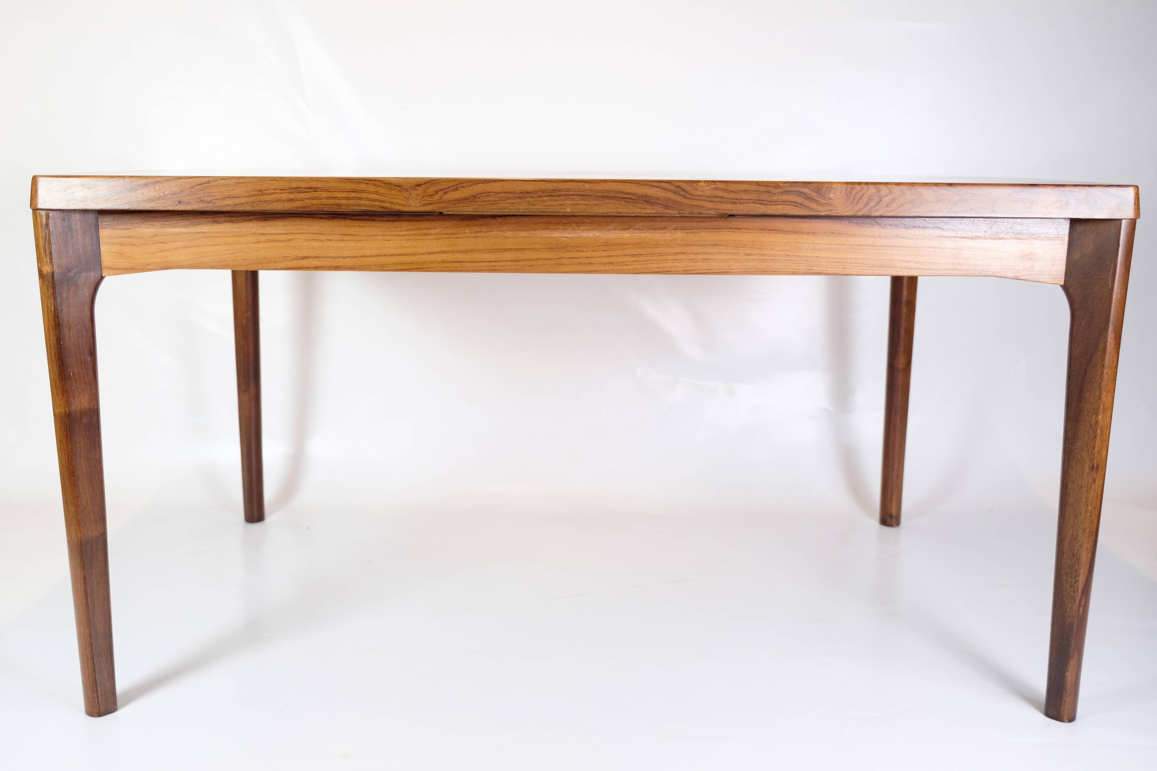 Dining Table With extensions Made In Rosewood By Henning Kjærnulf From 1960s