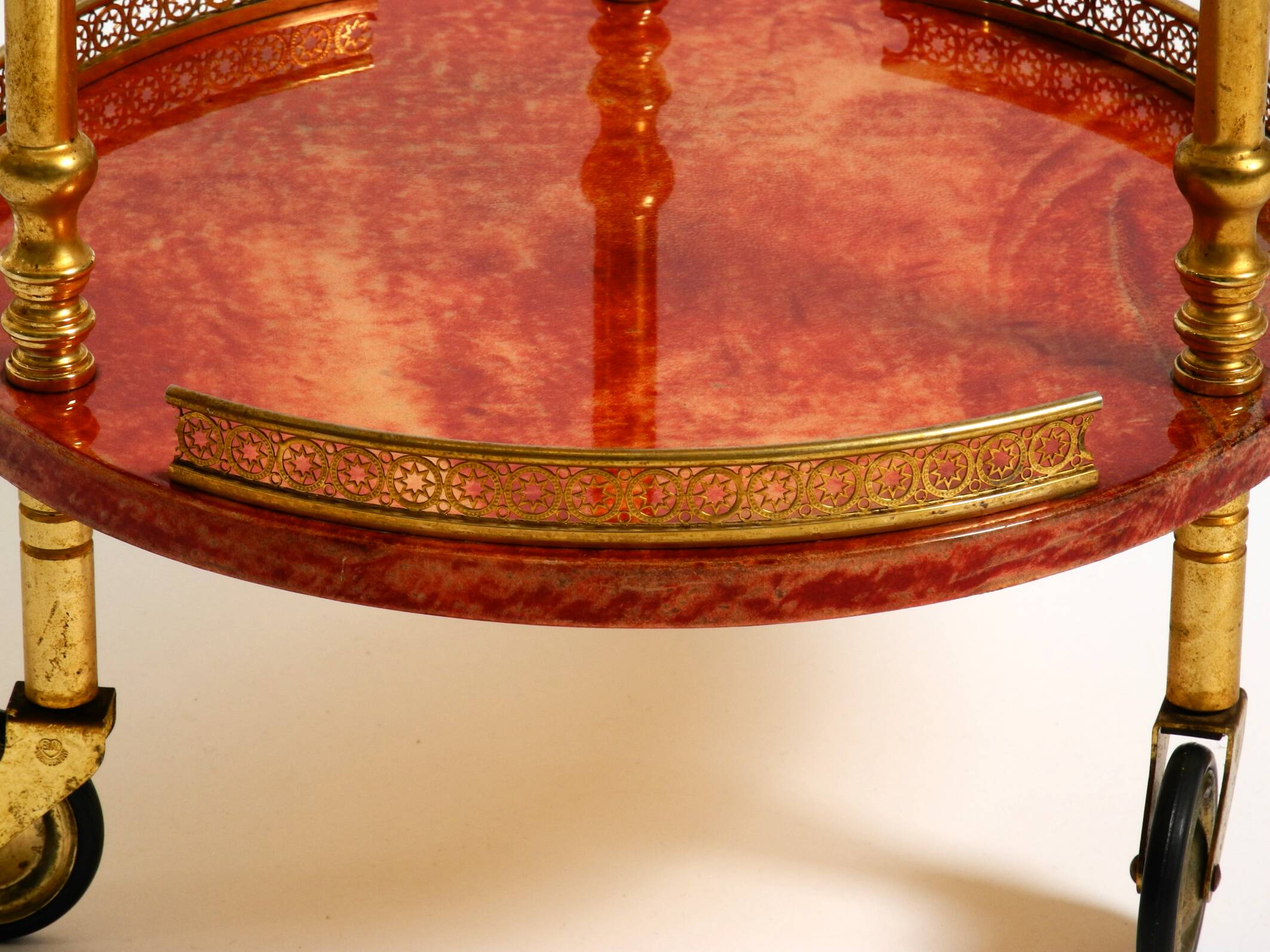 Round, small 1960s Aldo Tura serving or bar trolley in red goatskin leather
