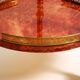 Round, small 1960s Aldo Tura serving or bar trolley in red goatskin leather