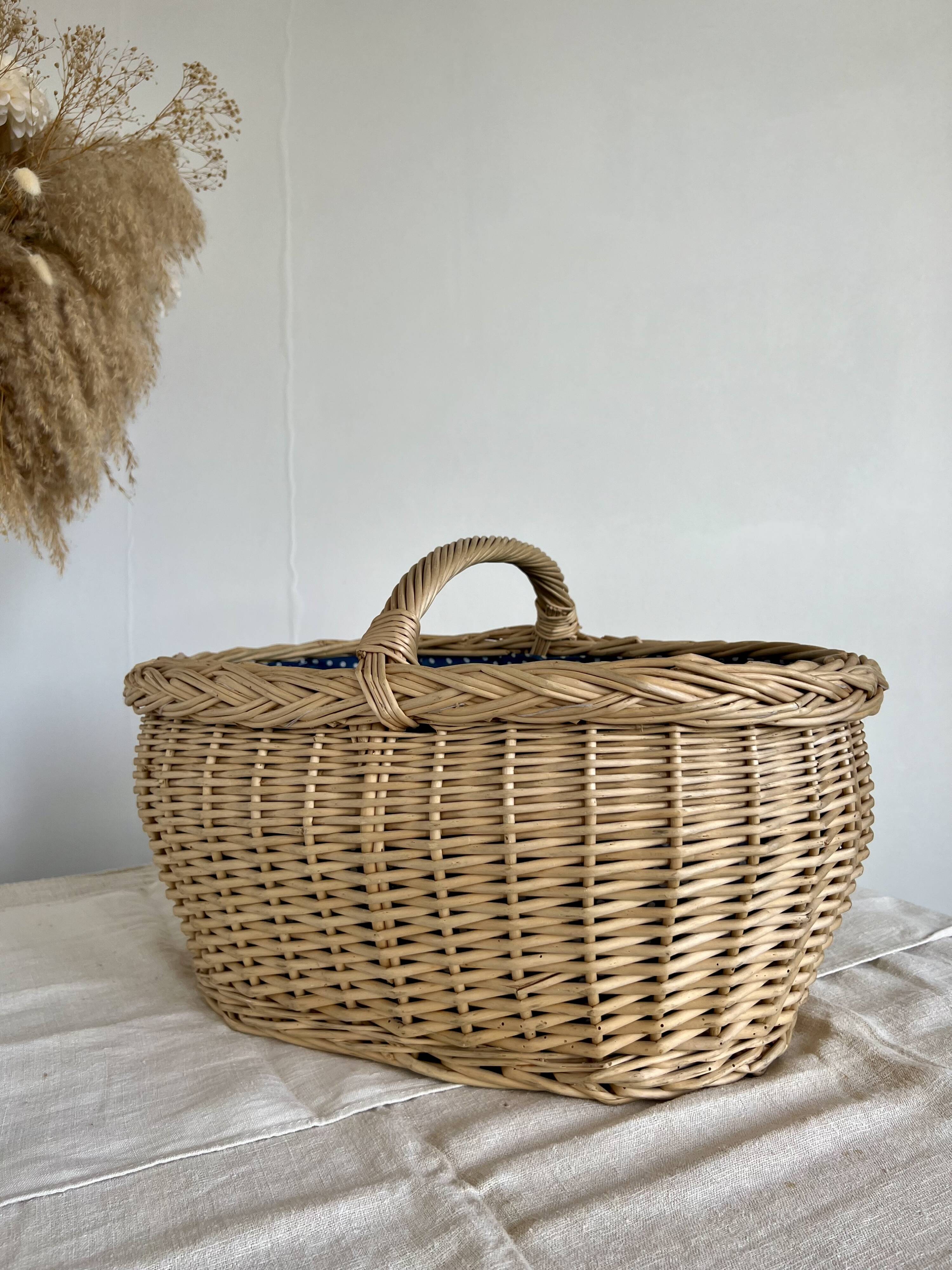 Large vintage wicker basket and blue lining with white polka dots