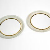 Pair of Mid Century wall mirrors with brass rim and white metal frames