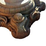 Antique cast iron garden table with decorative openwork top.