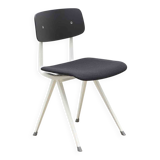 Friso Kramer "Result" chair upholstered in black and white.