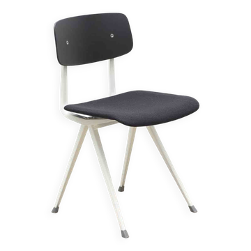 Friso Kramer "Result" chair upholstered in black and white.