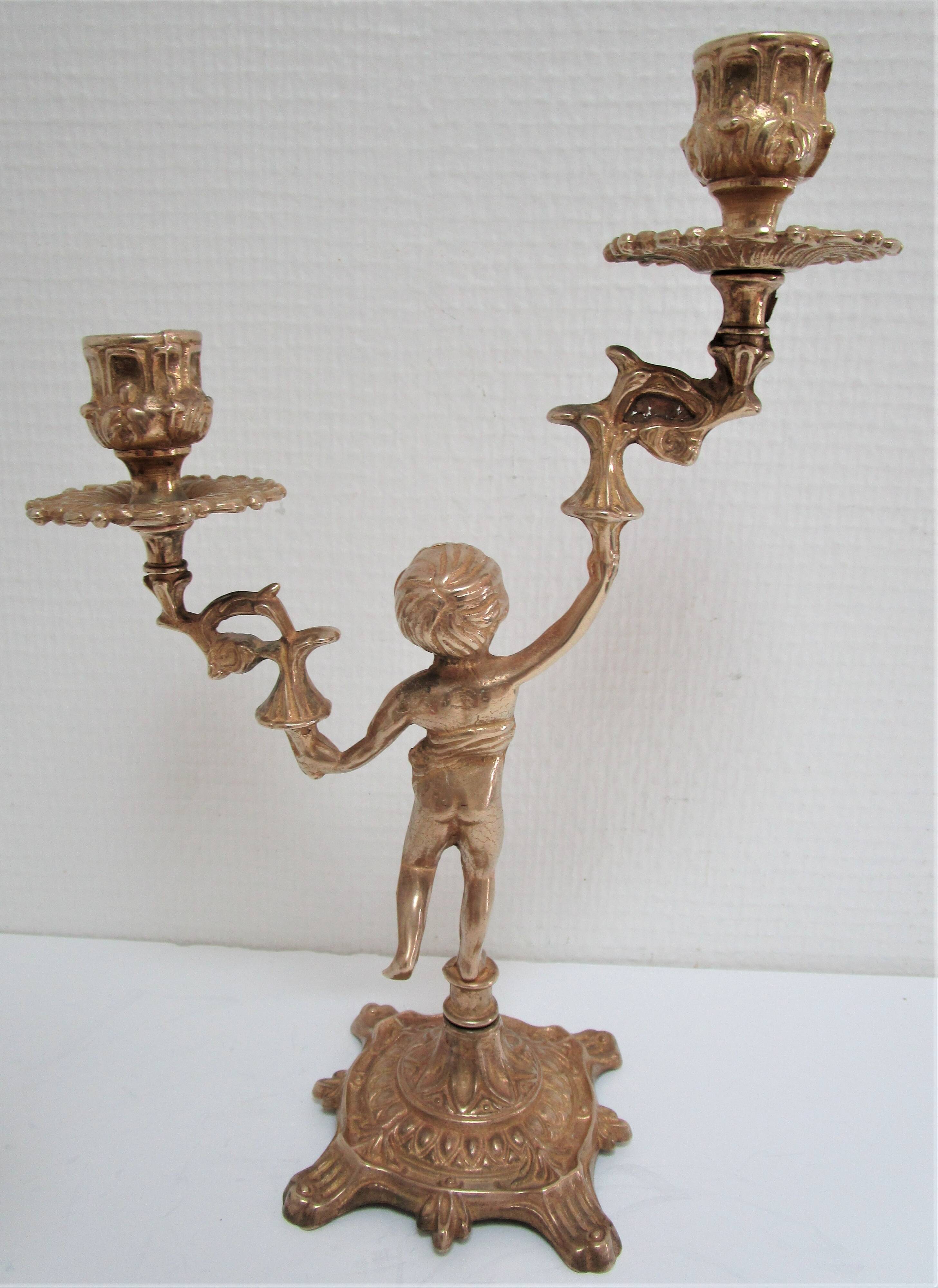 Pair of vintage golden brass cherub candlesticks