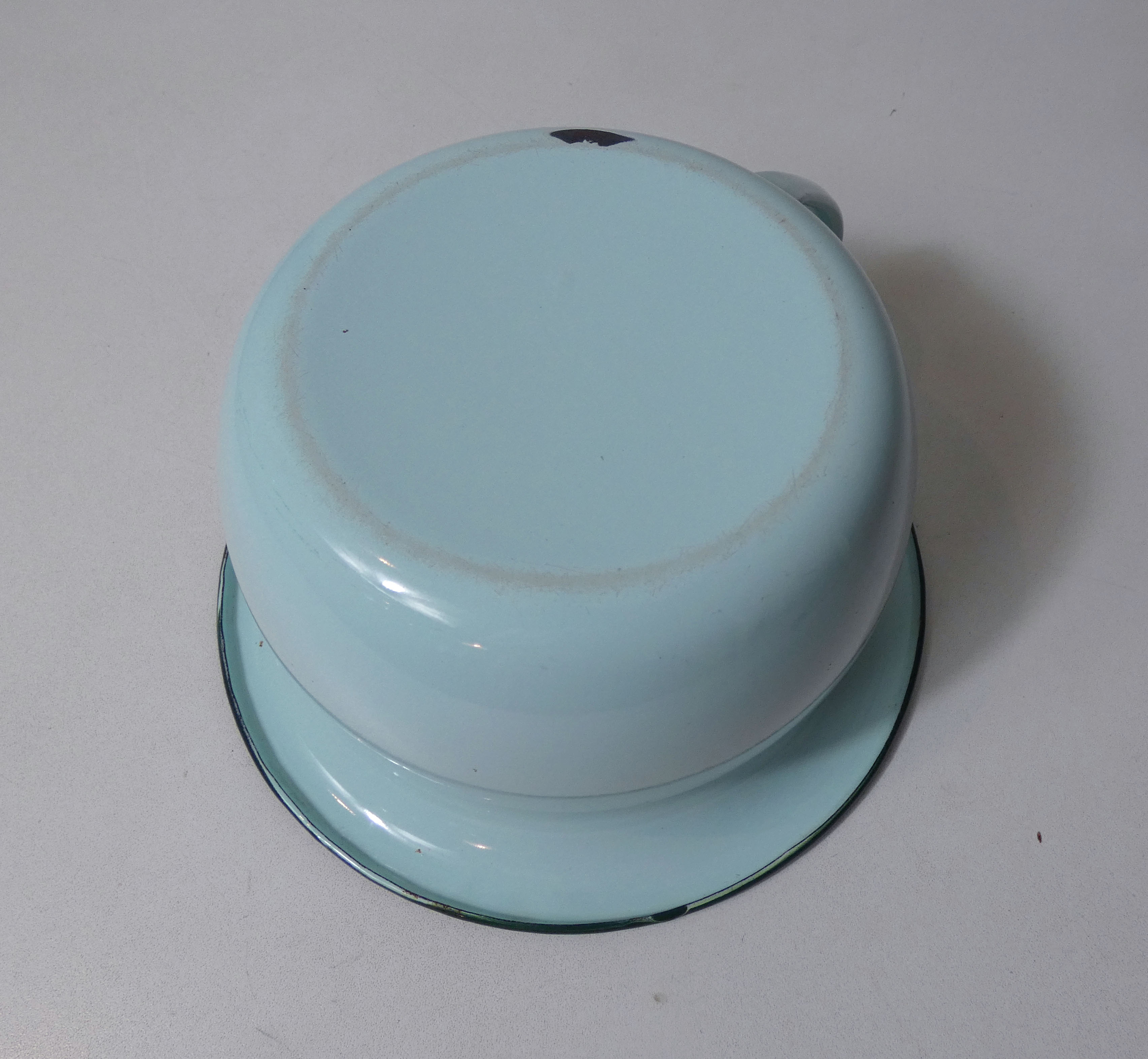 Old green enamelled steel pot cover