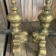 Pair of andirons and grates in cast iron and bronze with gilded grotesques, 17th century