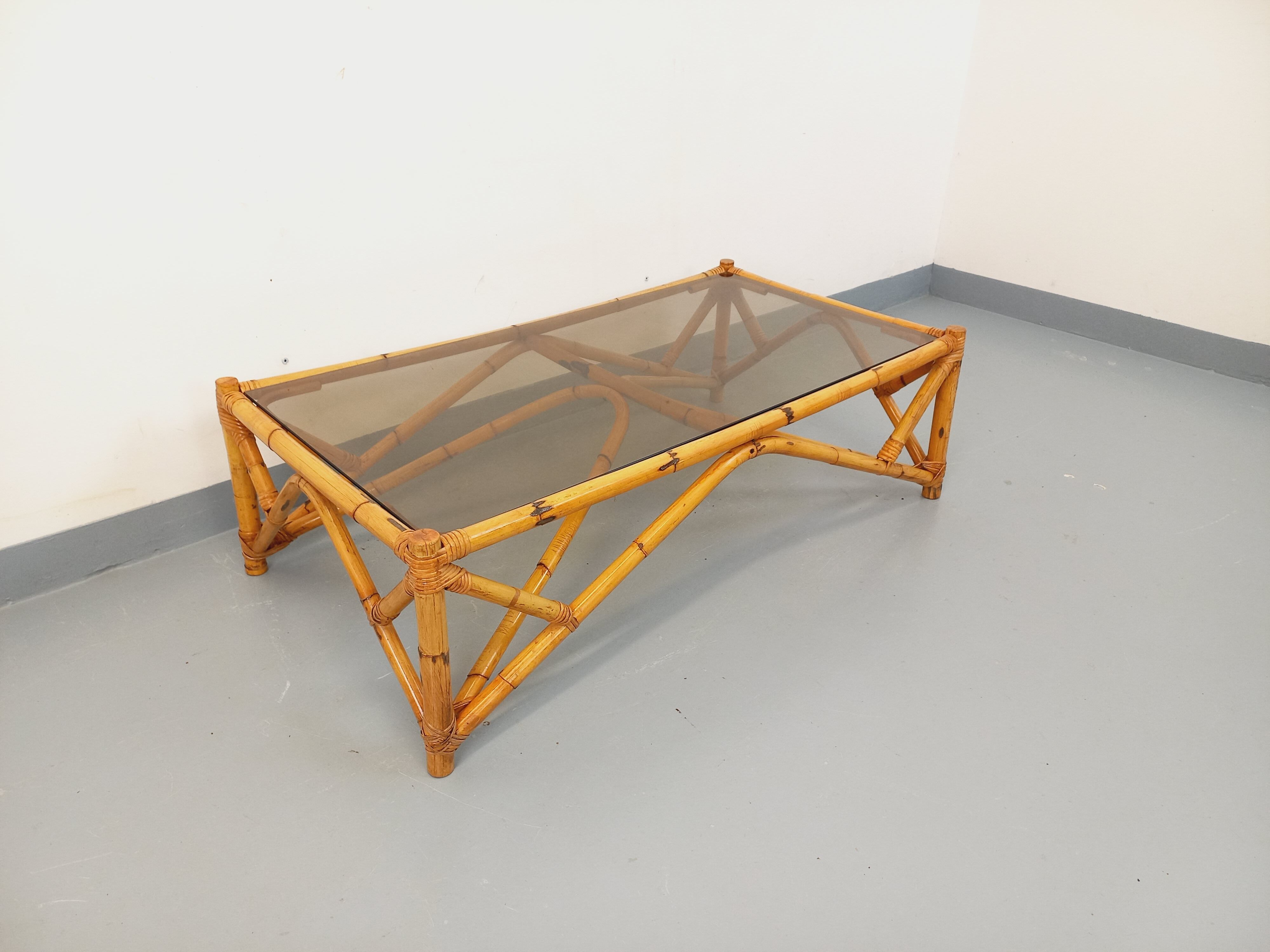 Vintage rectangular coffee table in rattan and smoked glass from the 1970s.