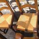 Set of 6 oak dining chairs with high backs and straw seats