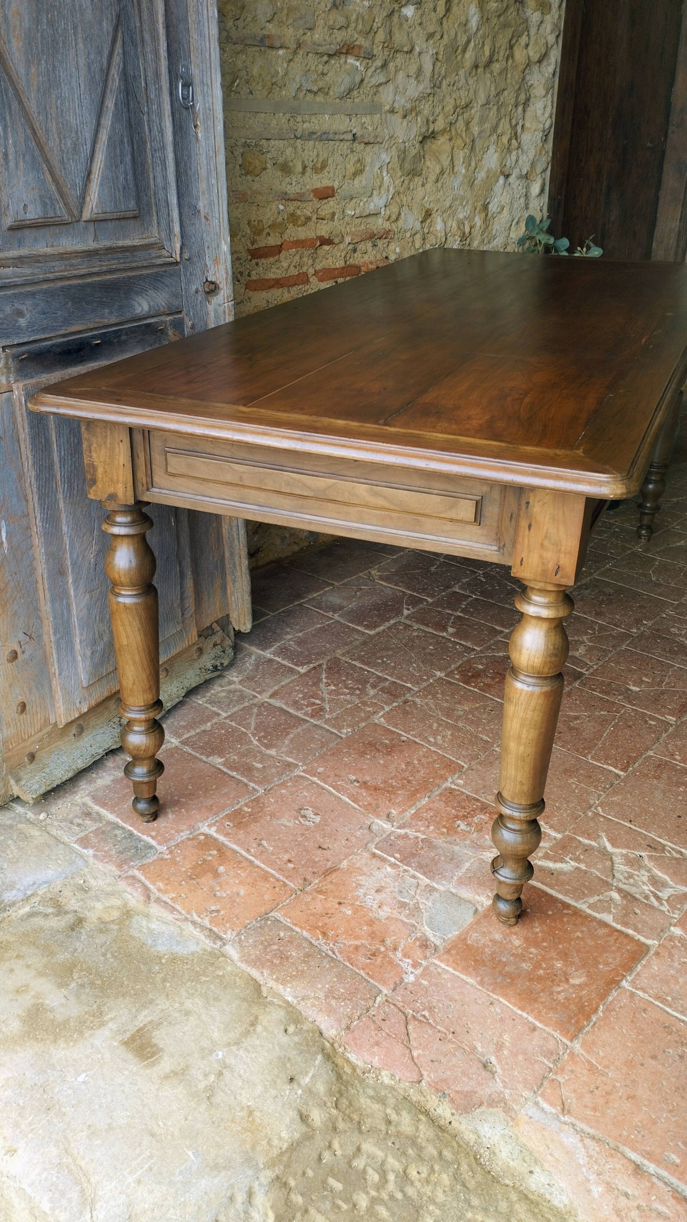 Old French farmhouse table in walnut, turned legs, waxed finish